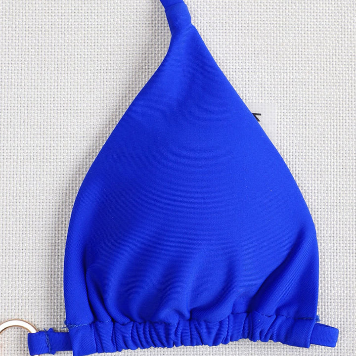 Dame triangel-bikini med lekfull knut och elegant guldaccent Mirla-Eva Jonsson