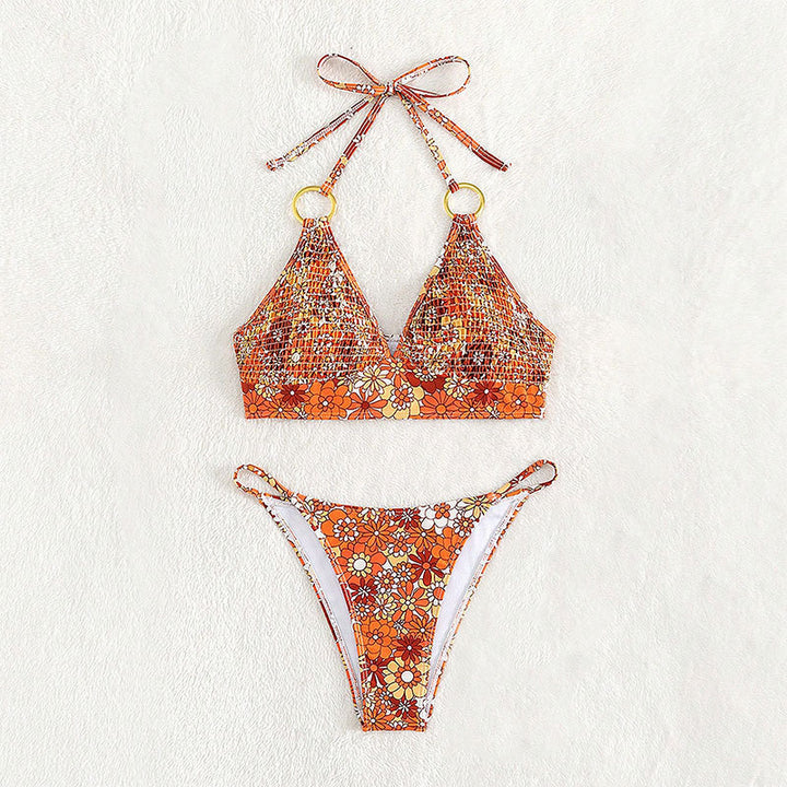 Dame triangelbikini med blommønster og gyldne ringdetaljer Mirla-Eva Jonsson