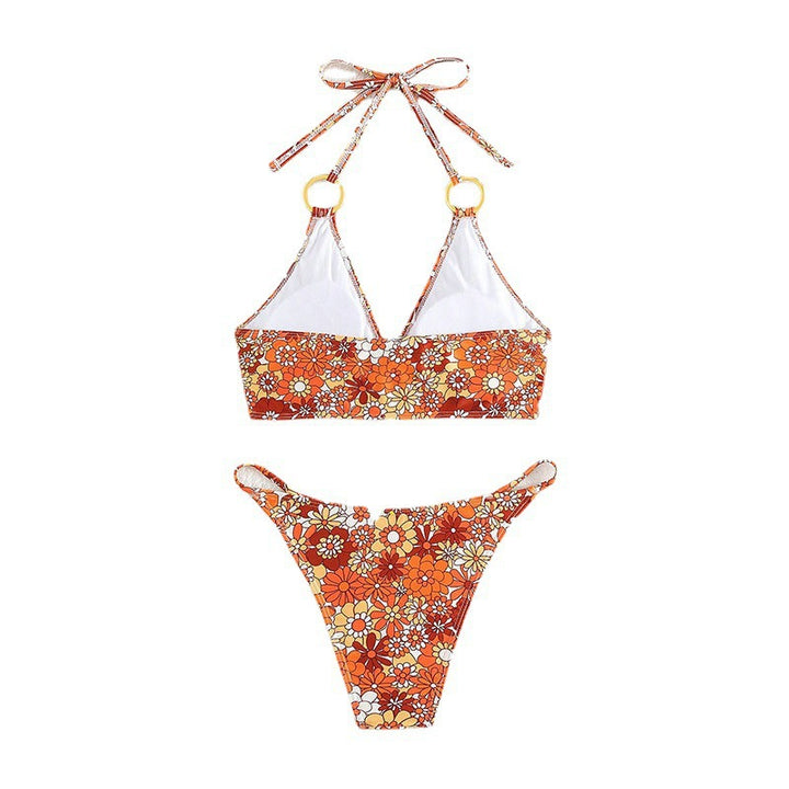 Dame triangelbikini med blommønster og gyldne ringdetaljer Mirla-Eva Jonsson