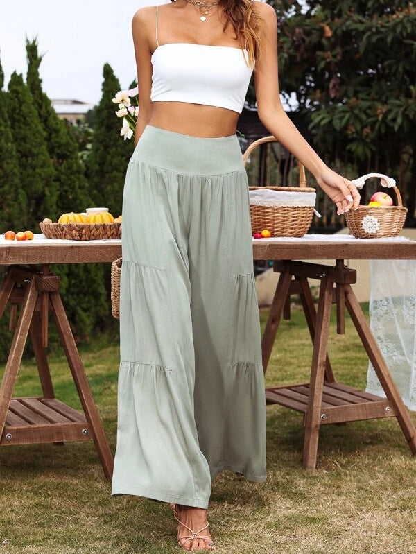 Dame vid culotte-byxor med eleganta volanger och hög midja Mirla-Eva Jonsson