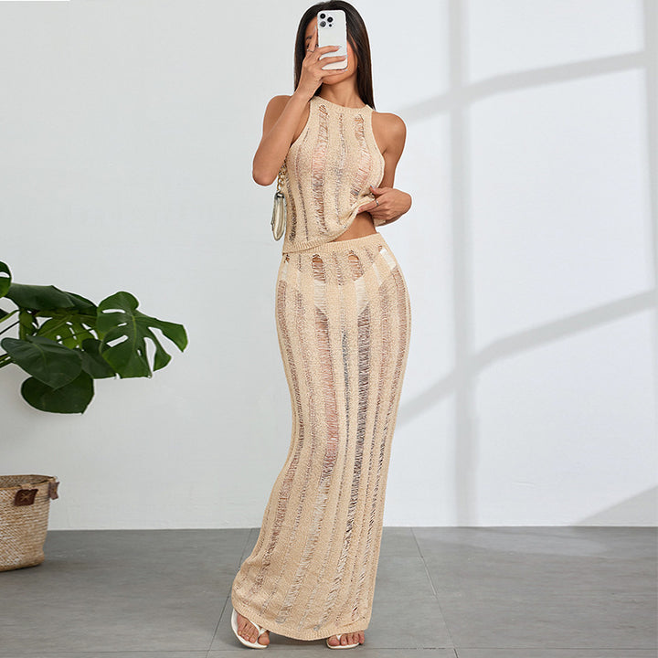 Dame virkad maxi klänning med djupa cut-outs och elegant design Mirla-Eva Jonsson
