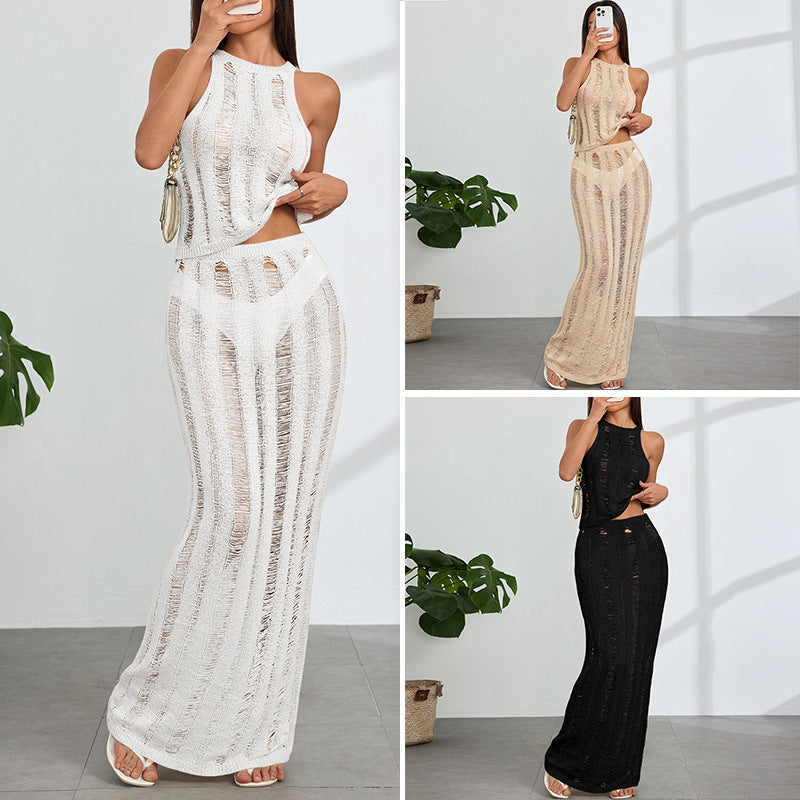 Dame virkad maxi klänning med djupa cut-outs och elegant design Mirla-Eva Jonsson