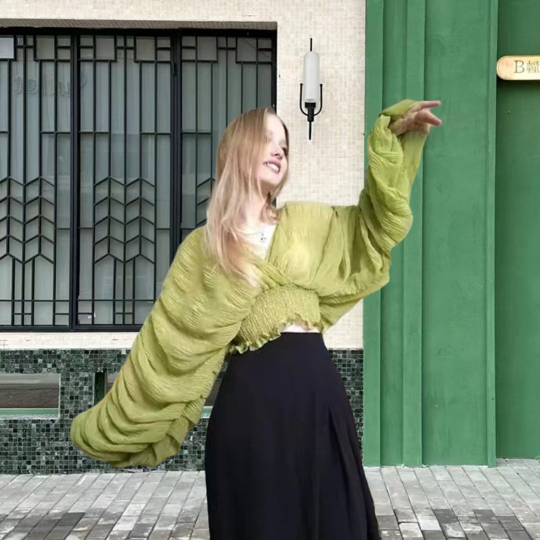 Dame wrap-blus med voluminösa ärmar och elegant design Mirla-Eva Jonsson