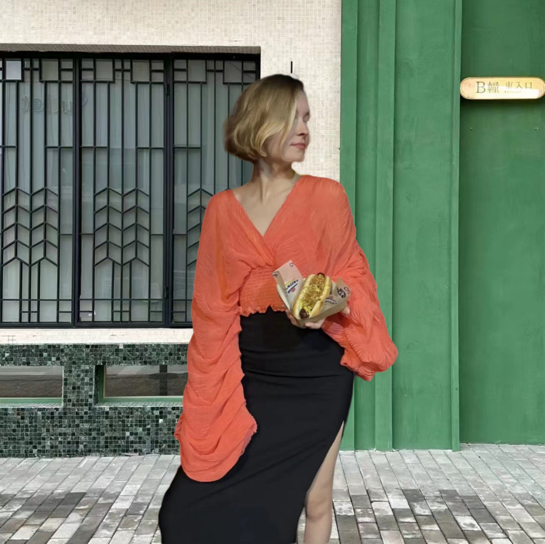 Dame wrap-blus med voluminösa ärmar och elegant design Mirla-Eva Jonsson