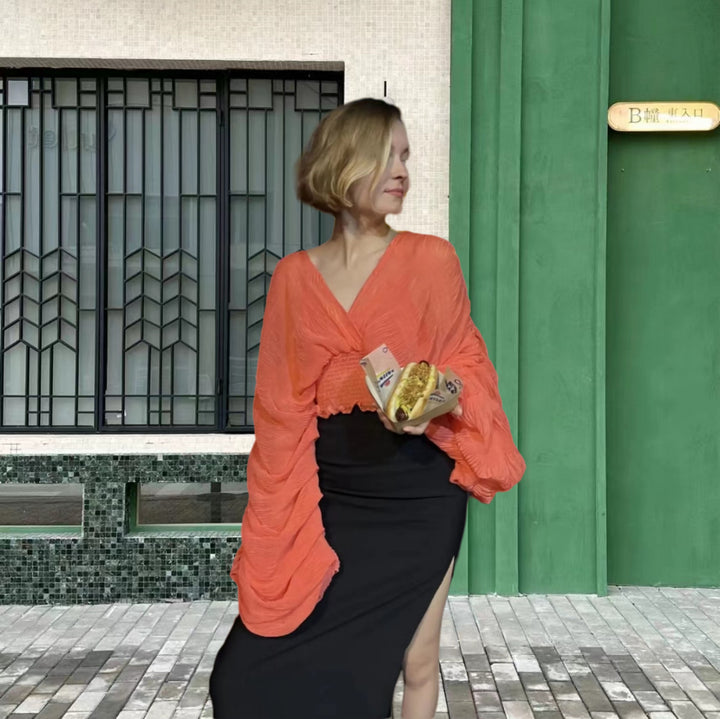 Dame wrap-blus med voluminösa ärmar och elegant design Mirla-Eva Jonsson
