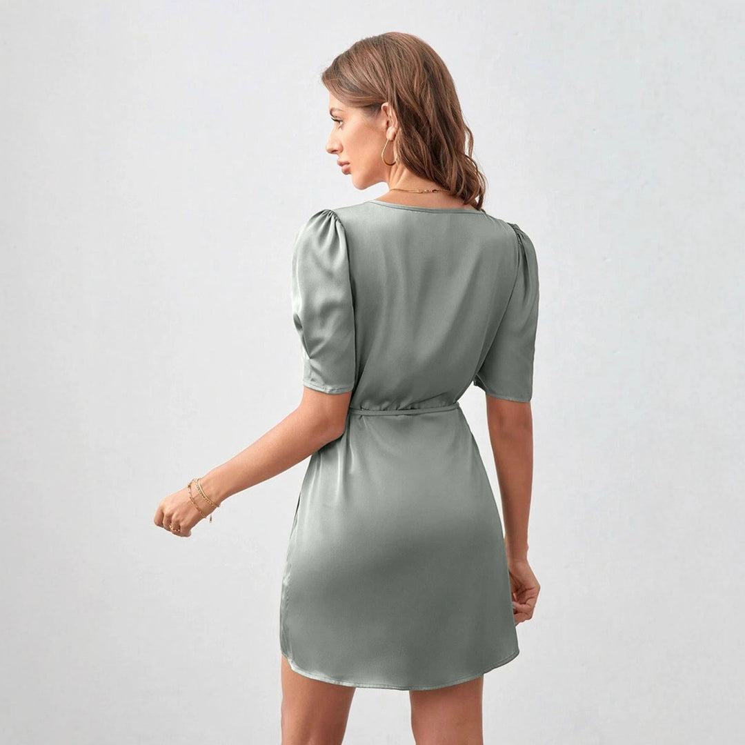 Dame wrap dress with elegant puff sleeves and cropped hem Mirla-Eva Jonsson