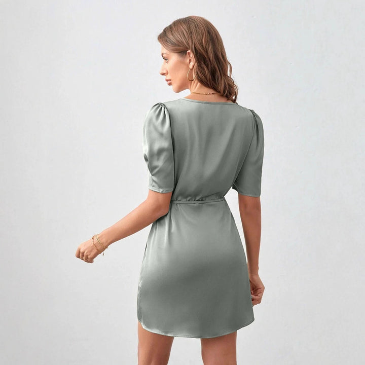 Dame wrap dress with elegant puff sleeves and cropped hem Mirla-Eva Jonsson