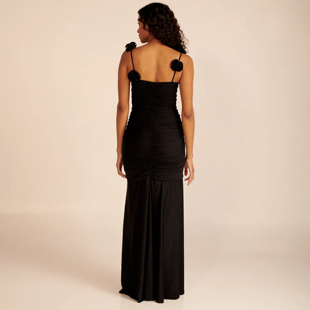 Dame wrap dress with sophisticated pleats and playful floral details Mirla-Eva Jonsson
