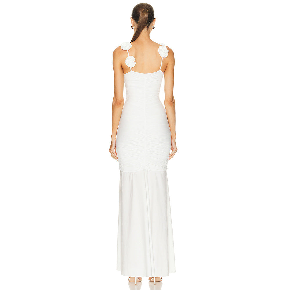 Dame wrap dress with sophisticated pleats and playful floral details Mirla-Eva Jonsson