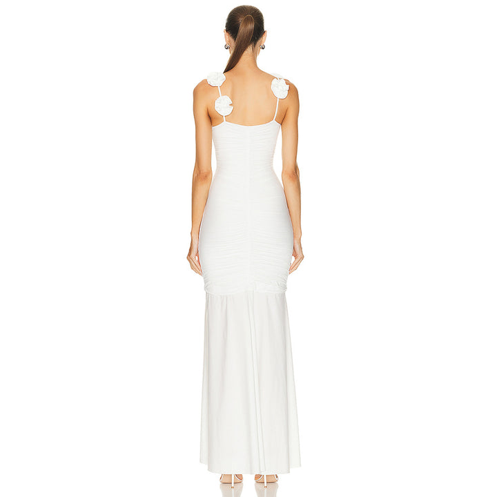 Dame wrap dress with sophisticated pleats and playful floral details Mirla-Eva Jonsson
