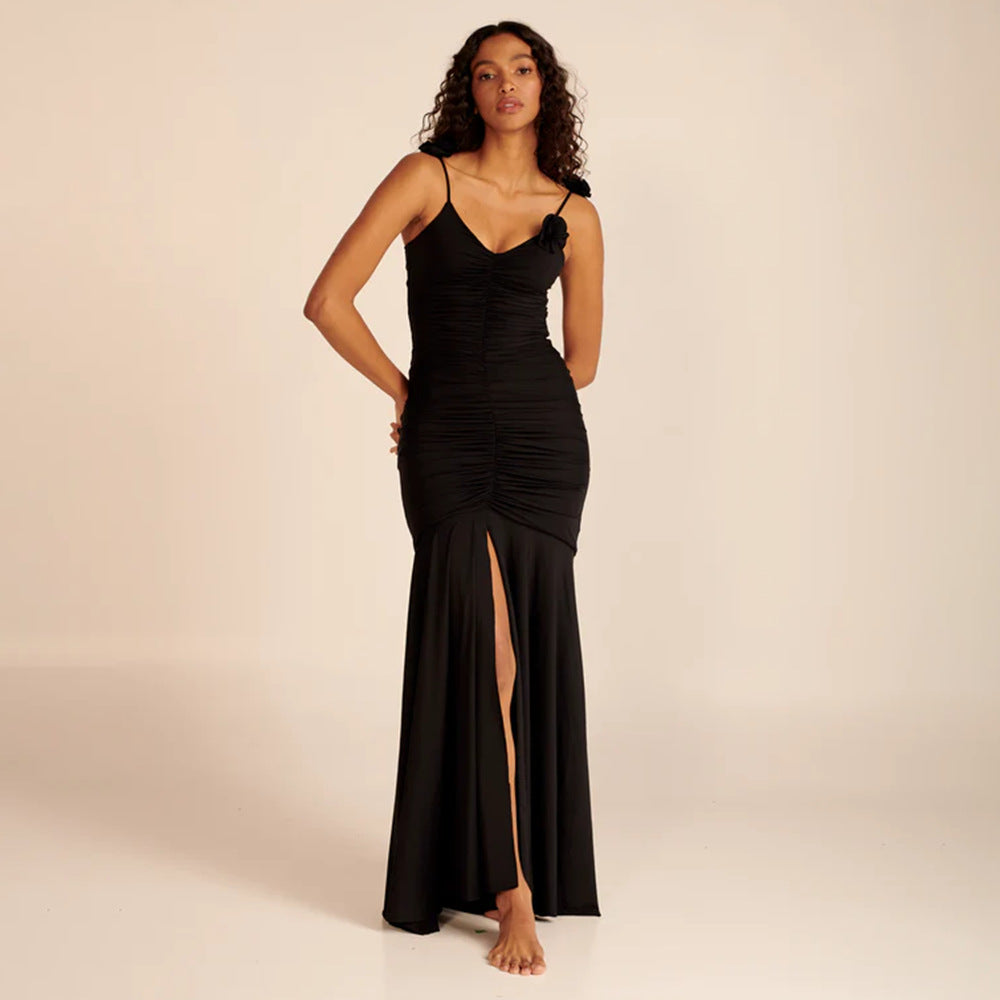 Dame wrap dress with sophisticated pleats and playful floral details Mirla-Eva Jonsson