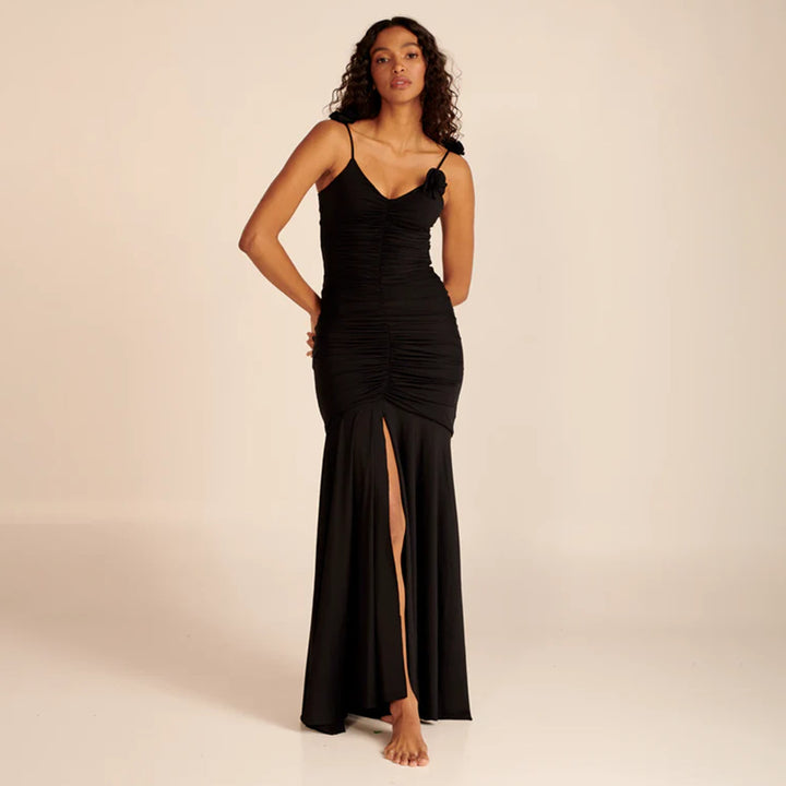 Dame wrap dress with sophisticated pleats and playful floral details Mirla-Eva Jonsson