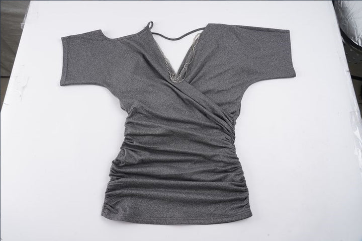 Dame wrap top med asymmetrisk skärning och volangdetaljer Mirla-Eva Jonsson