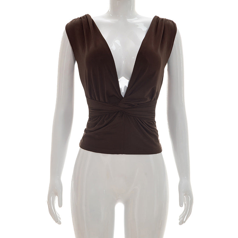 Dame wrap top med djup V-urringning och elegant knutdetalj Mirla-Eva Jonsson