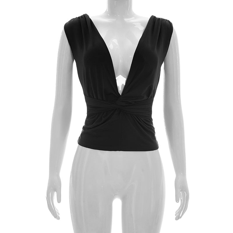 Dame wrap top med djup V-urringning och elegant knutdetalj Mirla-Eva Jonsson