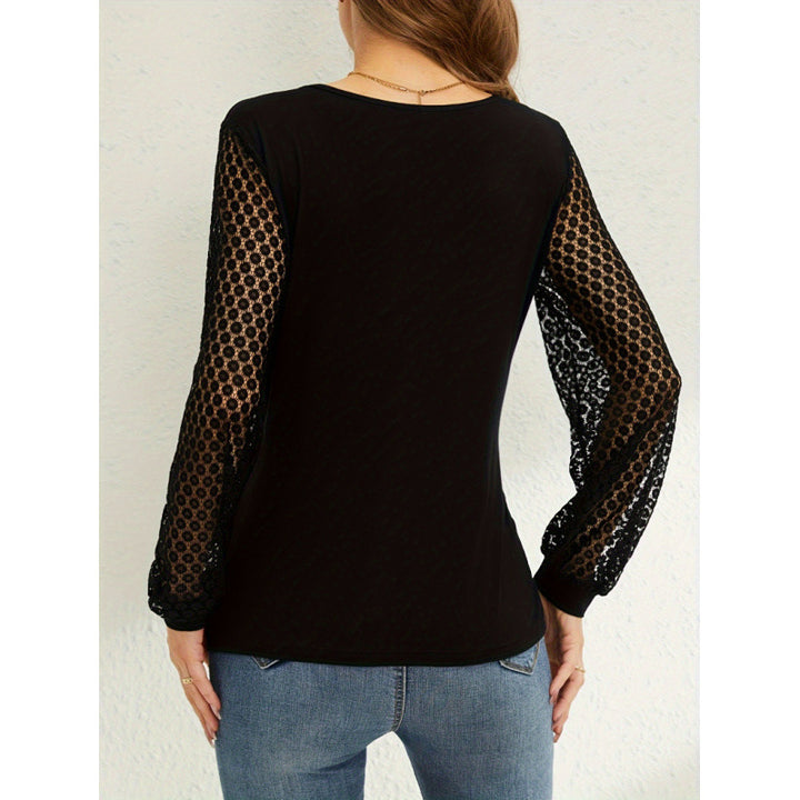 Dame wrap top med transparenta ärmar och moderiktig V-ringning Mirla-Eva Jonsson