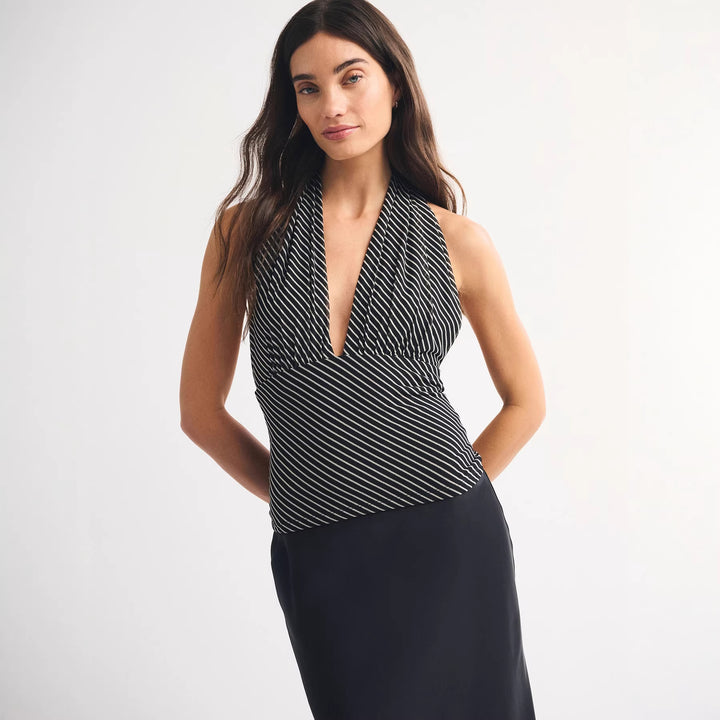 Dame wrap top with stylish polka dot design and deep neckline Mirla-Eva Jonsson