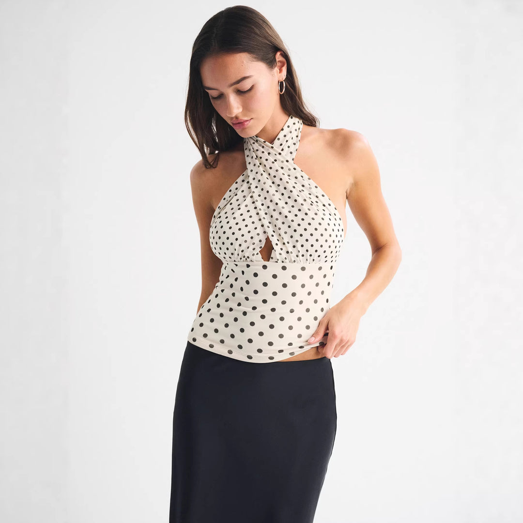 Dame wrap top with stylish polka dot design and deep neckline Mirla-Eva Jonsson