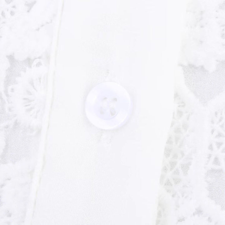 Dameblus med blommig spetssats Mirla-Eva Jonsson