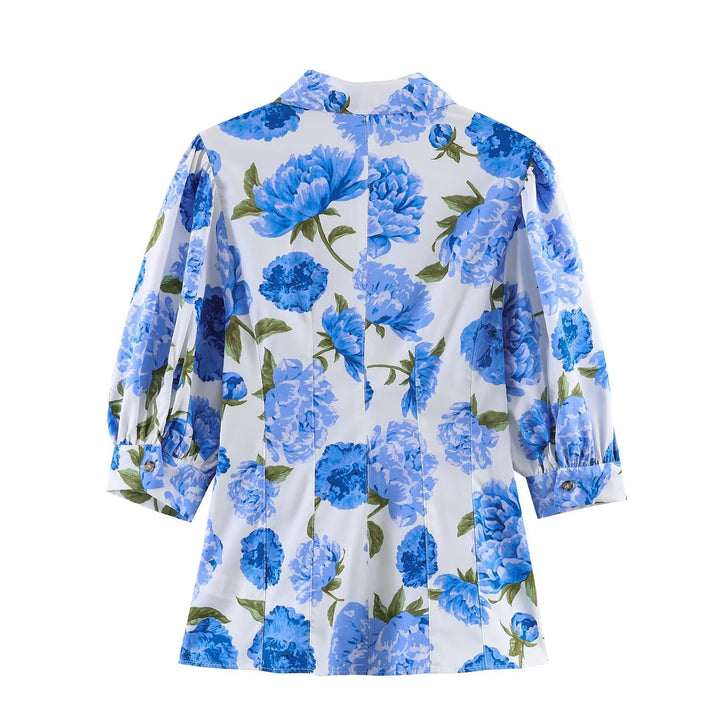 Dameblus med blommönster och eleganta puffärmar Mirla-Eva Jonsson