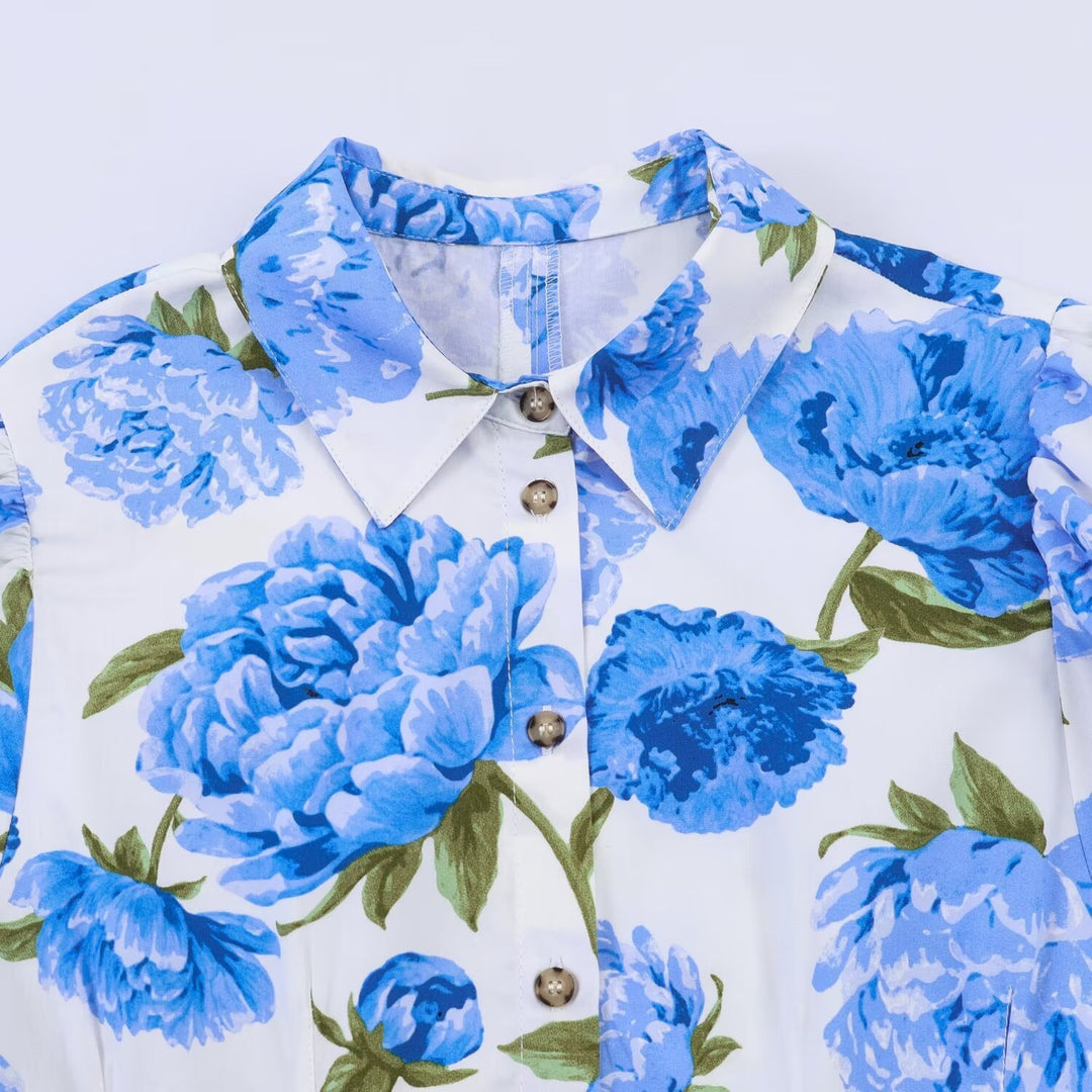 Dameblus med blommönster och eleganta puffärmar Mirla-Eva Jonsson
