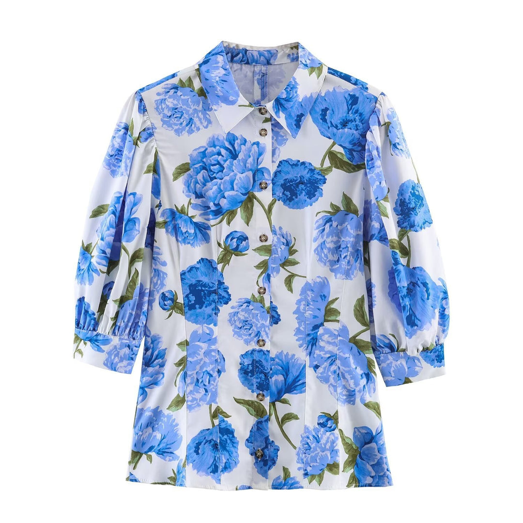 Dameblus med blommönster och eleganta puffärmar Mirla-Eva Jonsson