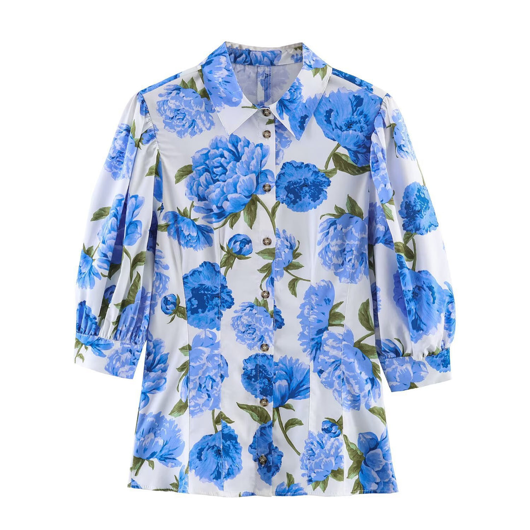 Dameblus med blommönster och eleganta puffärmar Mirla-Eva Jonsson