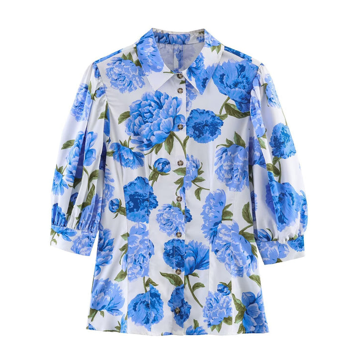 Dameblus med blommönster och eleganta puffärmar Mirla-Eva Jonsson