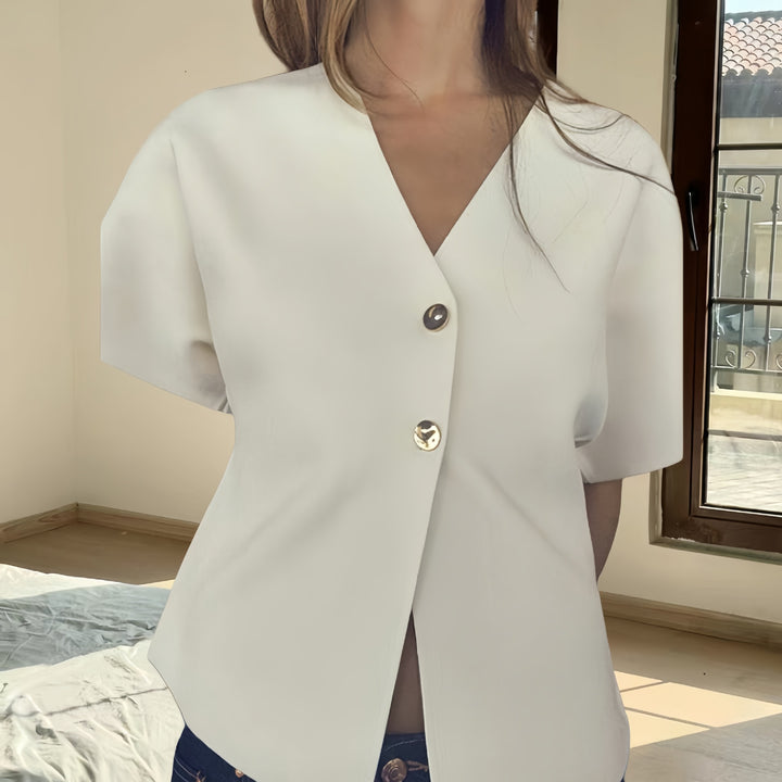 Dameblus med innovativ snitt och eleganta detaljer Mirla-Eva Jonsson