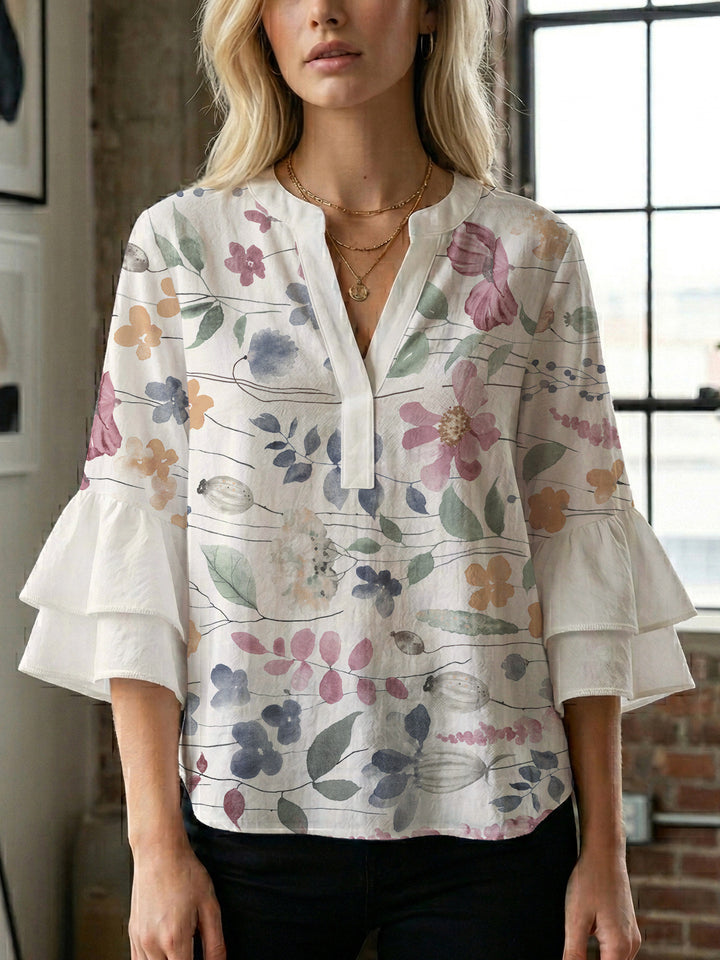 Dameblus med voluminösa ärmar och blommönster Mirla-Eva Jonsson