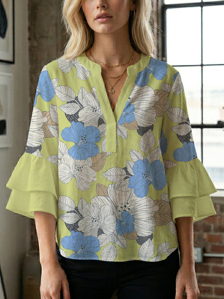Dameblus med voluminösa ärmar och blommönster Mirla-Eva Jonsson