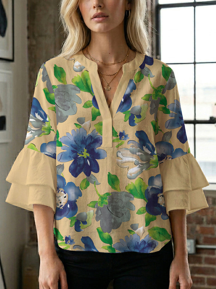 Dameblus med voluminösa ärmar och blommönster Mirla-Eva Jonsson