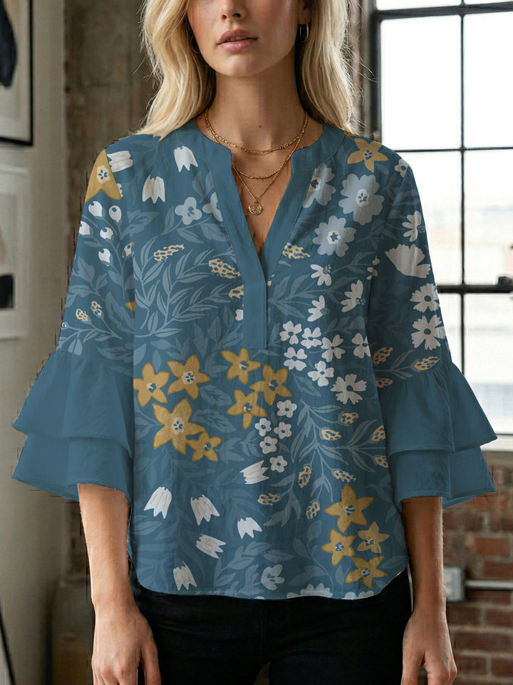 Dameblus med voluminösa ärmar och blommönster Mirla-Eva Jonsson
