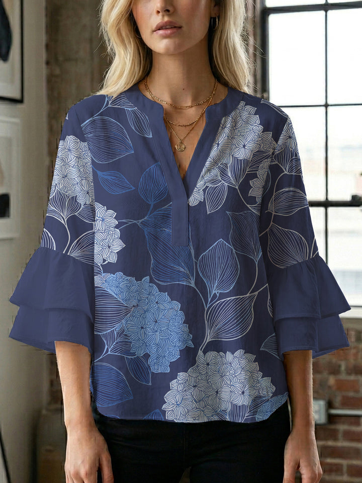 Dameblus med voluminösa ärmar och blommönster Mirla-Eva Jonsson