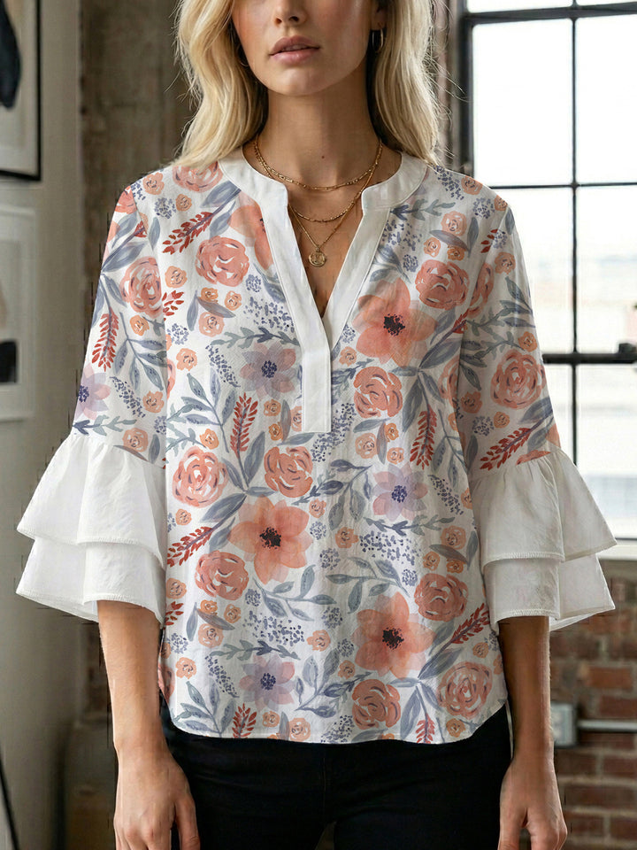 Dameblus med voluminösa ärmar och blommönster Mirla-Eva Jonsson