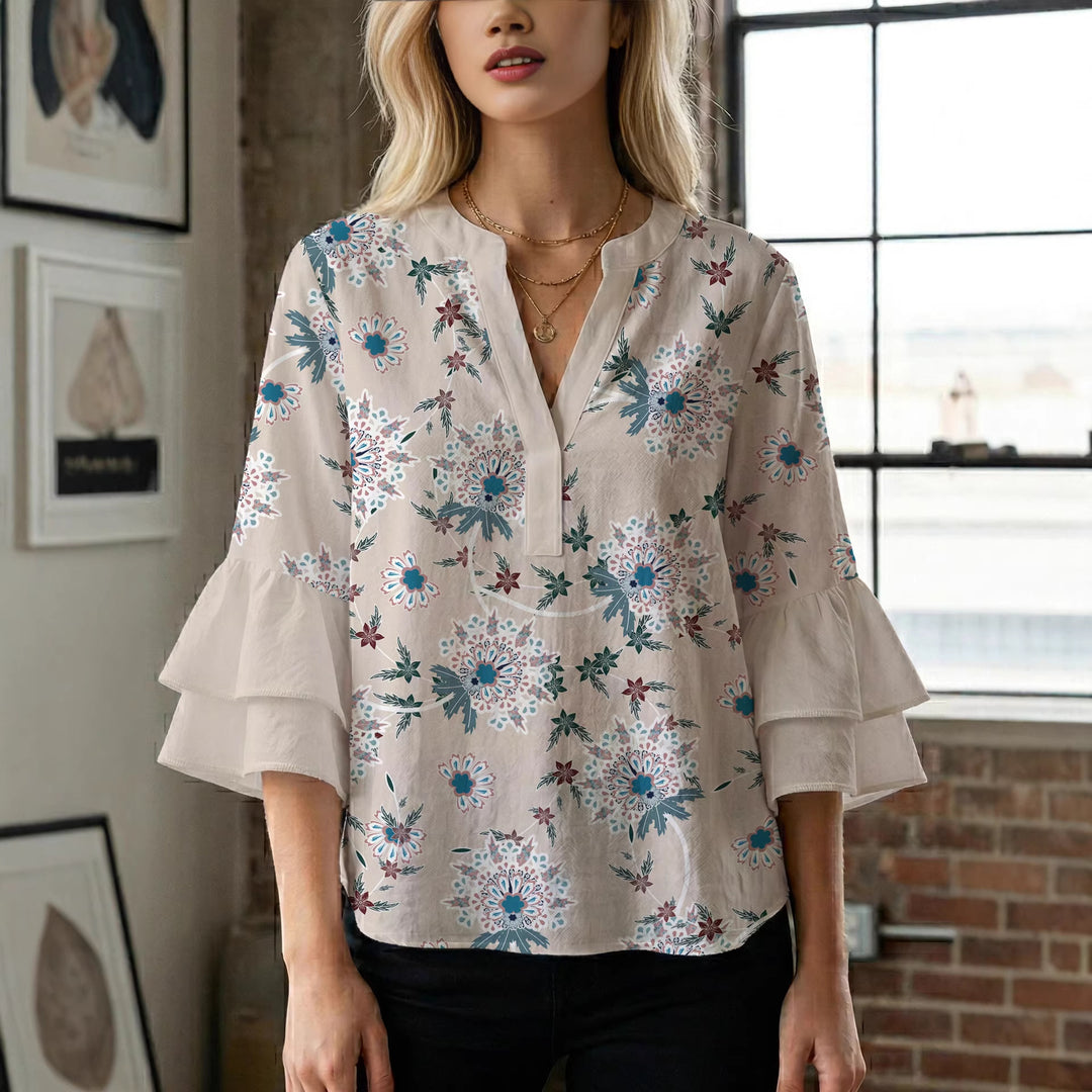 Dameblus med voluminösa ärmar och blommönster Mirla-Eva Jonsson