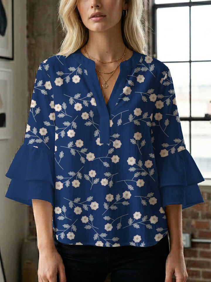 Dameblus med voluminösa ärmar och blommönster Mirla-Eva Jonsson