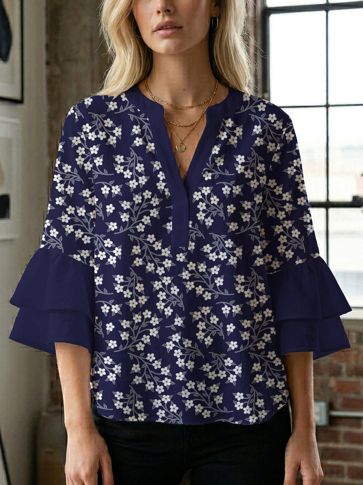 Dameblus med voluminösa ärmar och blommönster Mirla-Eva Jonsson