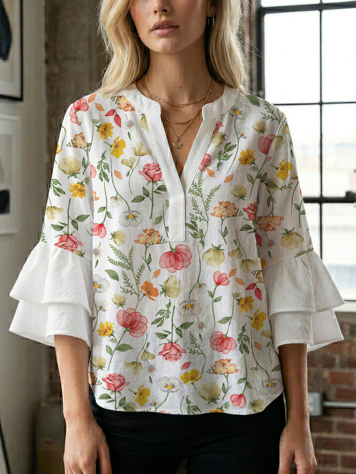 Dameblus med voluminösa ärmar och blommönster Mirla-Eva Jonsson