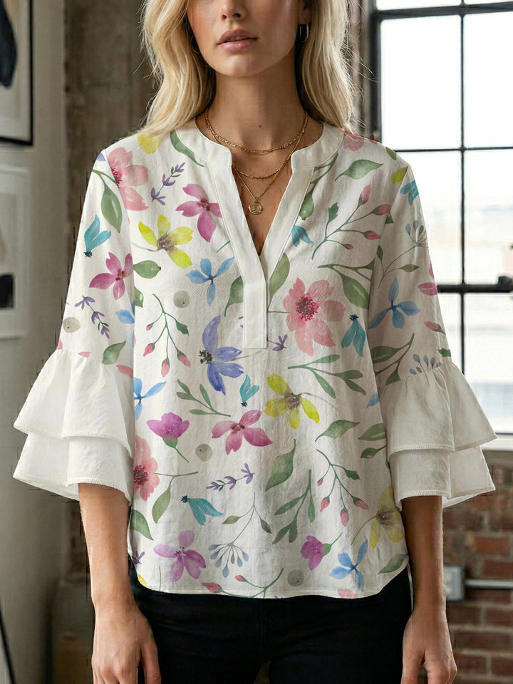 Dameblus med voluminösa ärmar och blommönster Mirla-Eva Jonsson