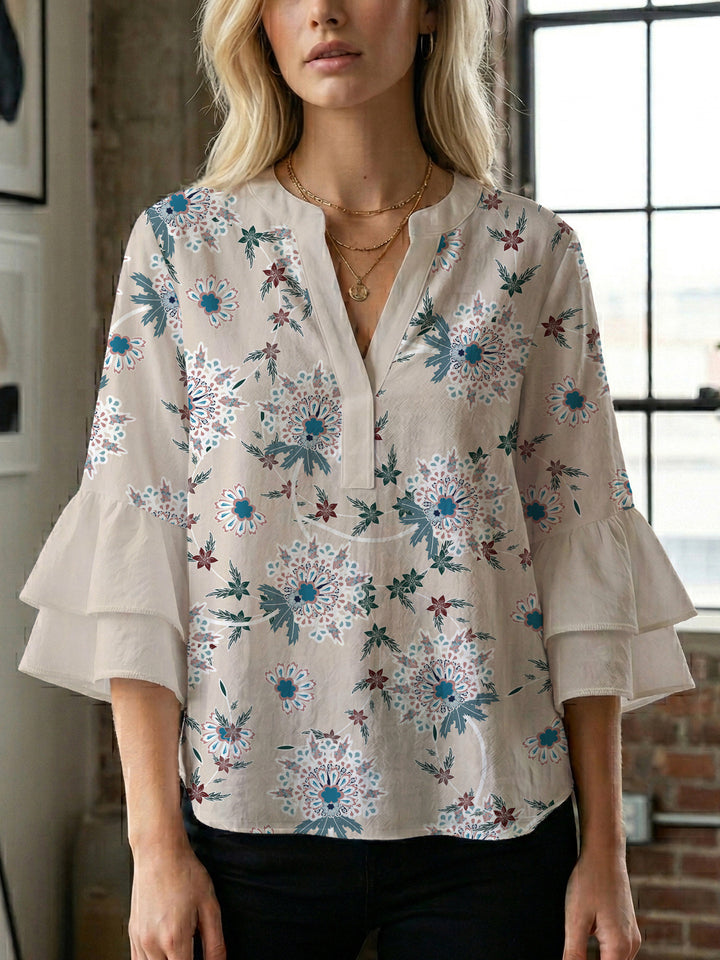 Dameblus med voluminösa ärmar och blommönster Mirla-Eva Jonsson