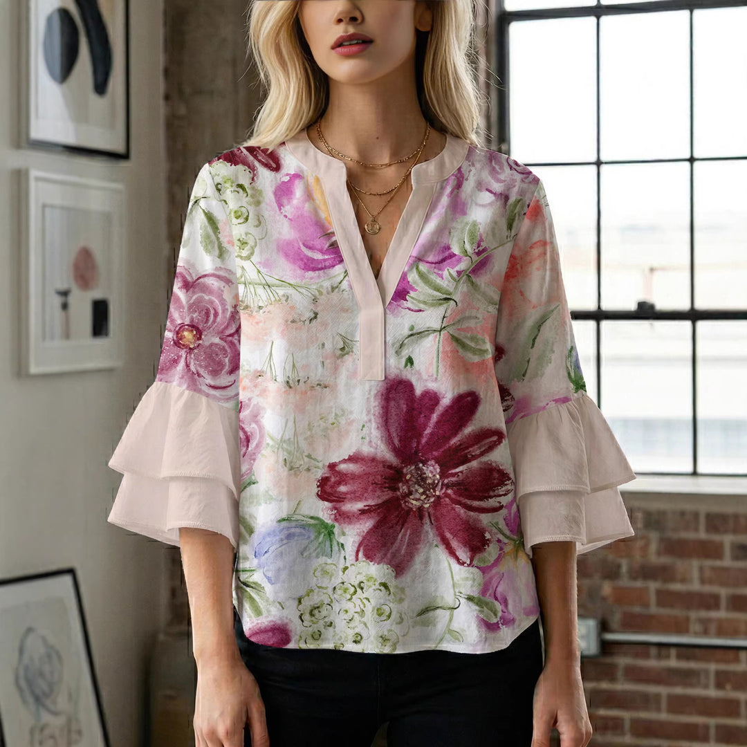Dameblus med voluminösa ärmar och blommönster Mirla-Eva Jonsson