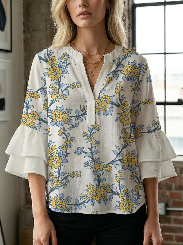 Dameblus med voluminösa ärmar och blommönster Mirla-Eva Jonsson