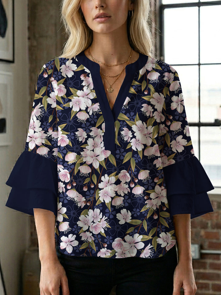 Dameblus med voluminösa ärmar och blommönster Mirla-Eva Jonsson