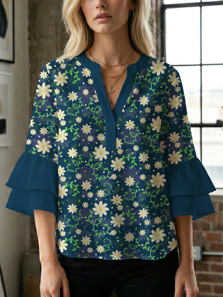 Dameblus med voluminösa ärmar och blommönster Mirla-Eva Jonsson