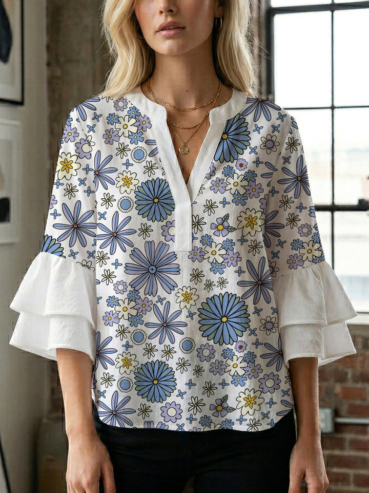 Dameblus med voluminösa ärmar och blommönster Mirla-Eva Jonsson