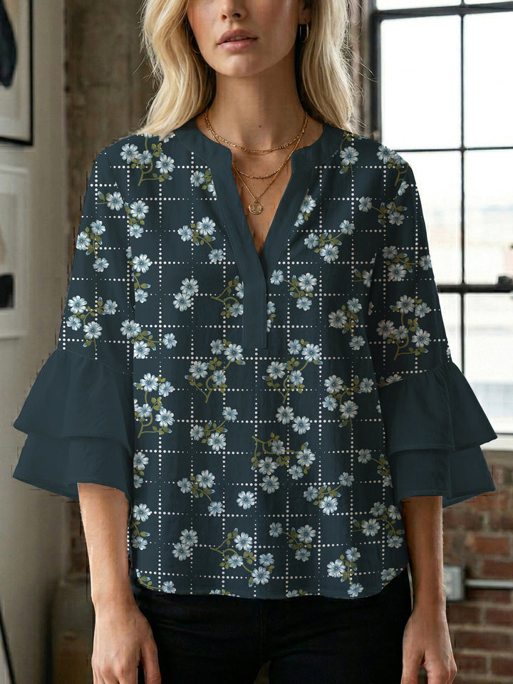 Dameblus med voluminösa ärmar och blommönster Mirla-Eva Jonsson