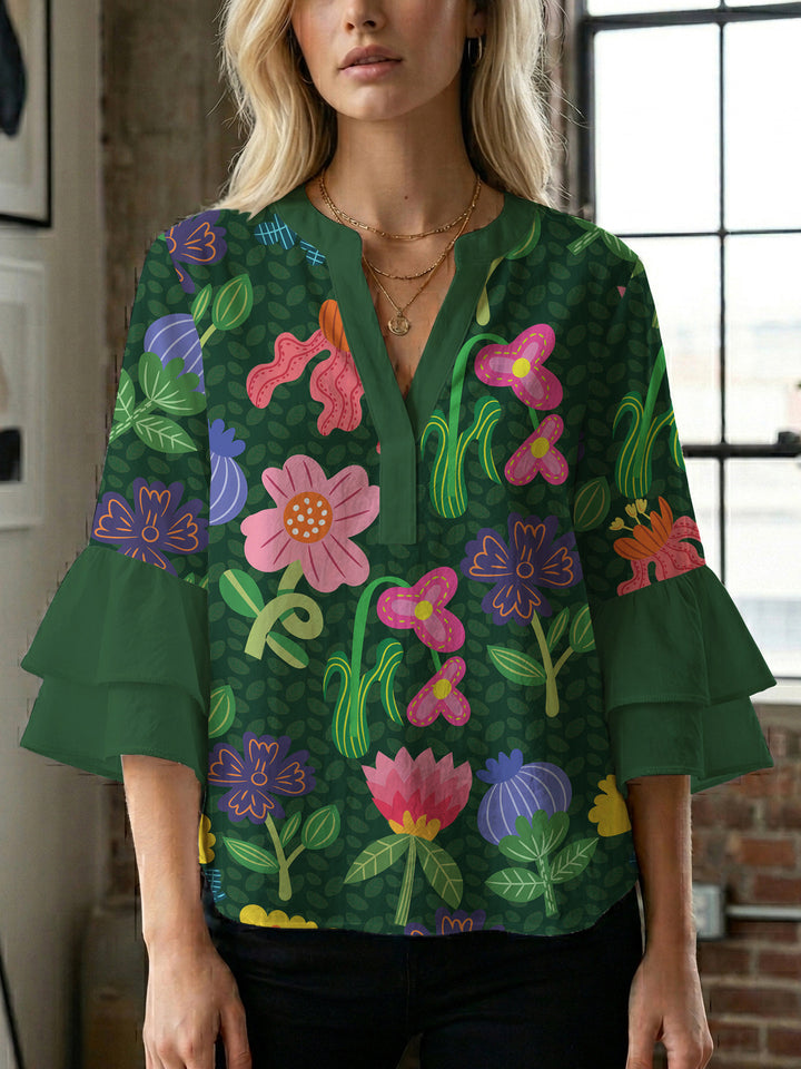 Dameblus med voluminösa ärmar och blommönster Mirla-Eva Jonsson