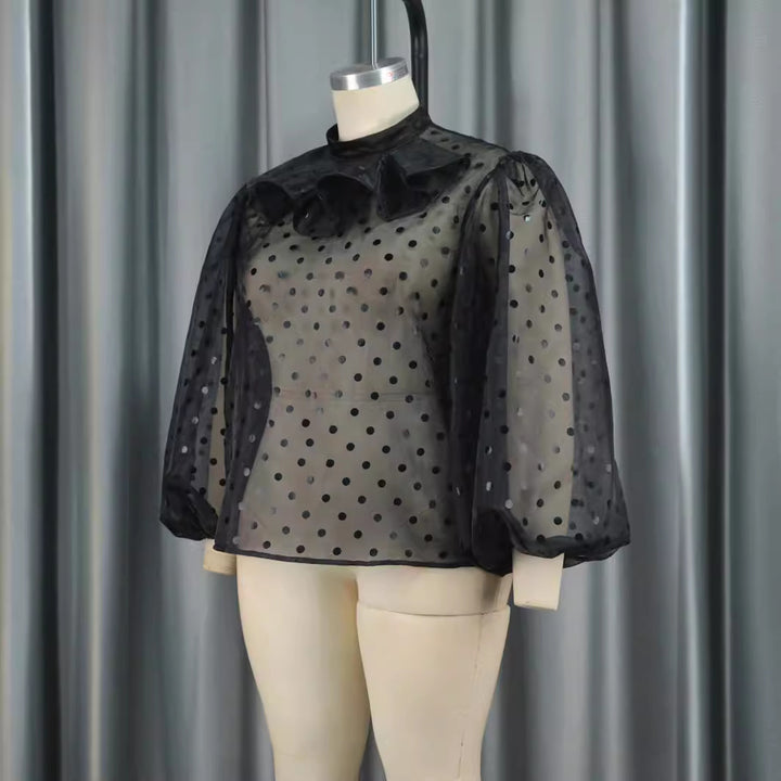 Dameblus med voluminösa puffärmar och polka prickar Mirla-Eva Jonsson