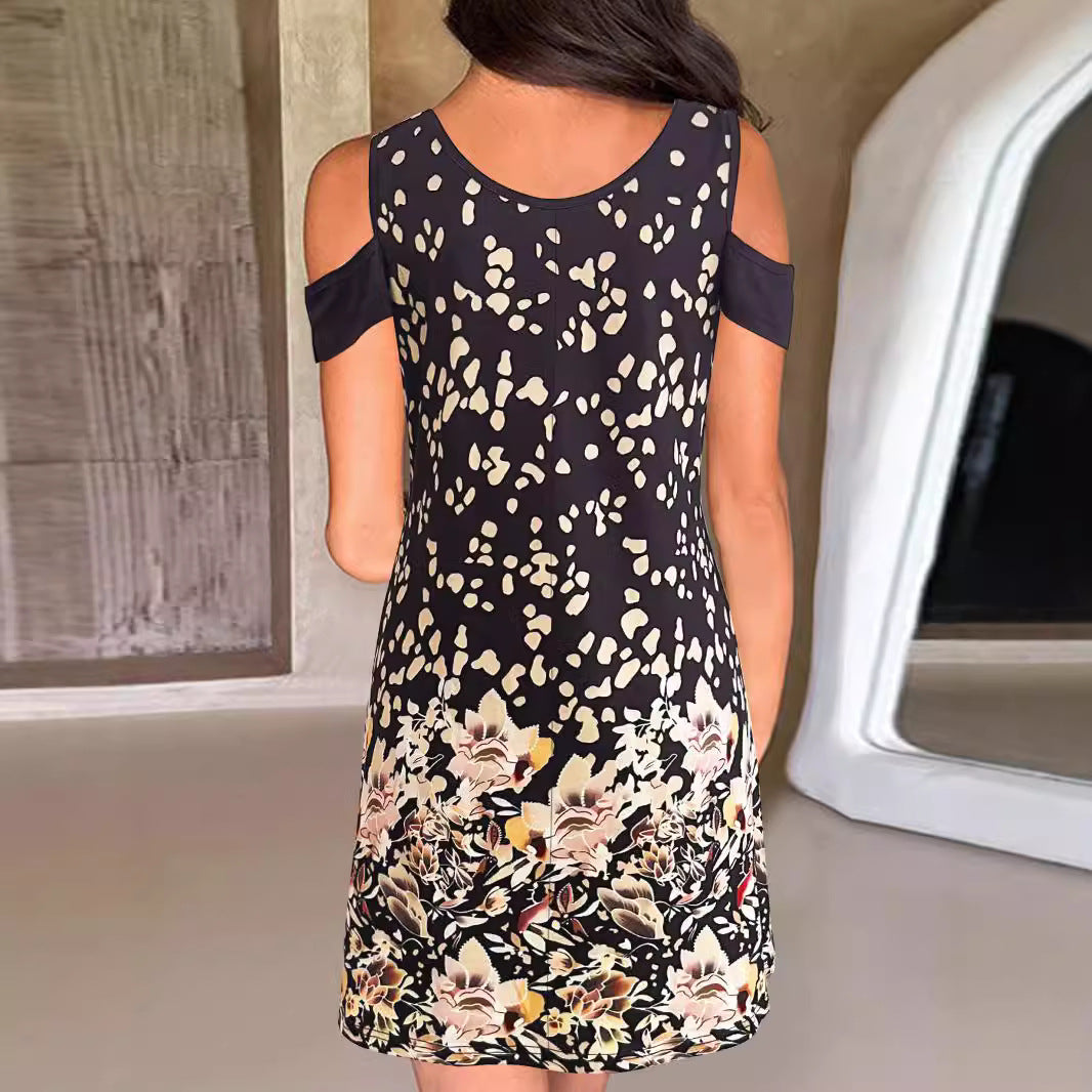 Dameklänning med trendiga axelklyvningar och elegant blommönster Mirla-Eva Jonsson